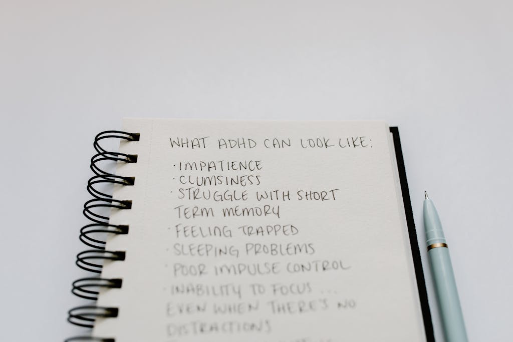 Handwritten list of symptoms showing what ADHD can look like, used in an article about the difference between ADD and ADHD.