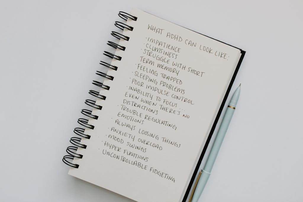 Handwritten list in a notebook about ADHD symptoms. What is the difference between ADD and ADHD?